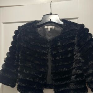 Used black faux fur coat